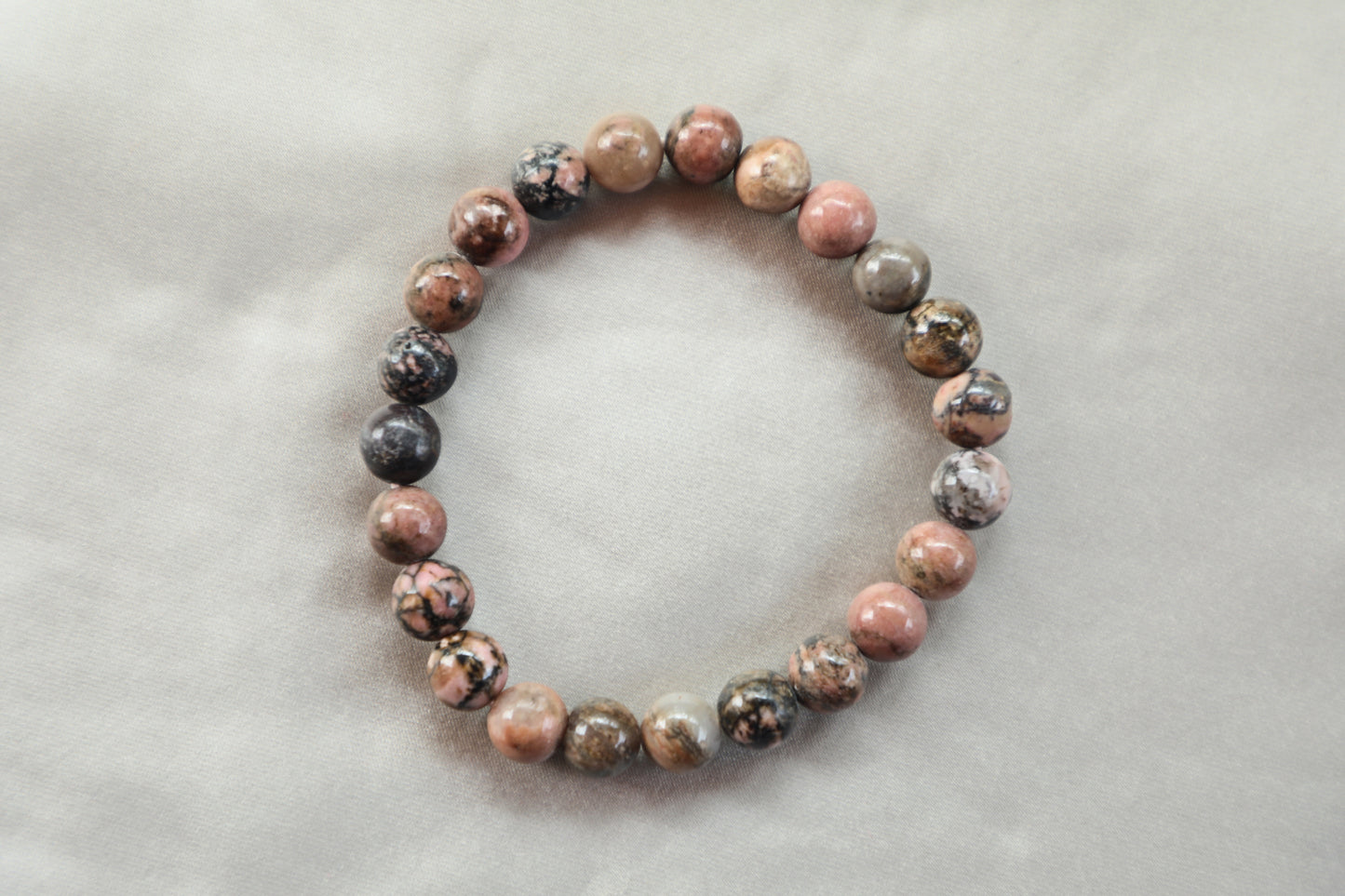 Find Emotional Healing and Inner Peace with the Power of Rhodonite. This calming and balancing stone promotes self-confidence, emotional healing, and improves memory and concentration. Associated with the zodiac sign of Taurus, Rhodonite is said to enhance the natural tendencies of this sign, such as their stability and practicality. Support your heart chakra and transform your life with the healing properties of Rhodonite today.