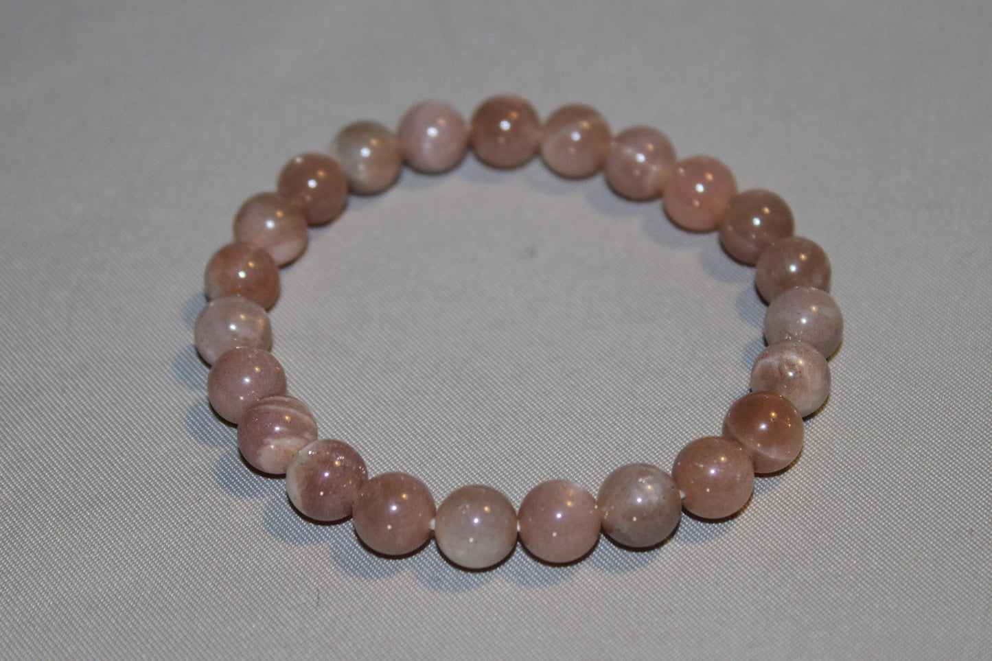 Peach Moonstone Healing Properties: Calming Energy, Emotional Balance, & Intuition Boost for Cancer Zodiac Sign. A Gentle Gemstone with Soothing Energy.